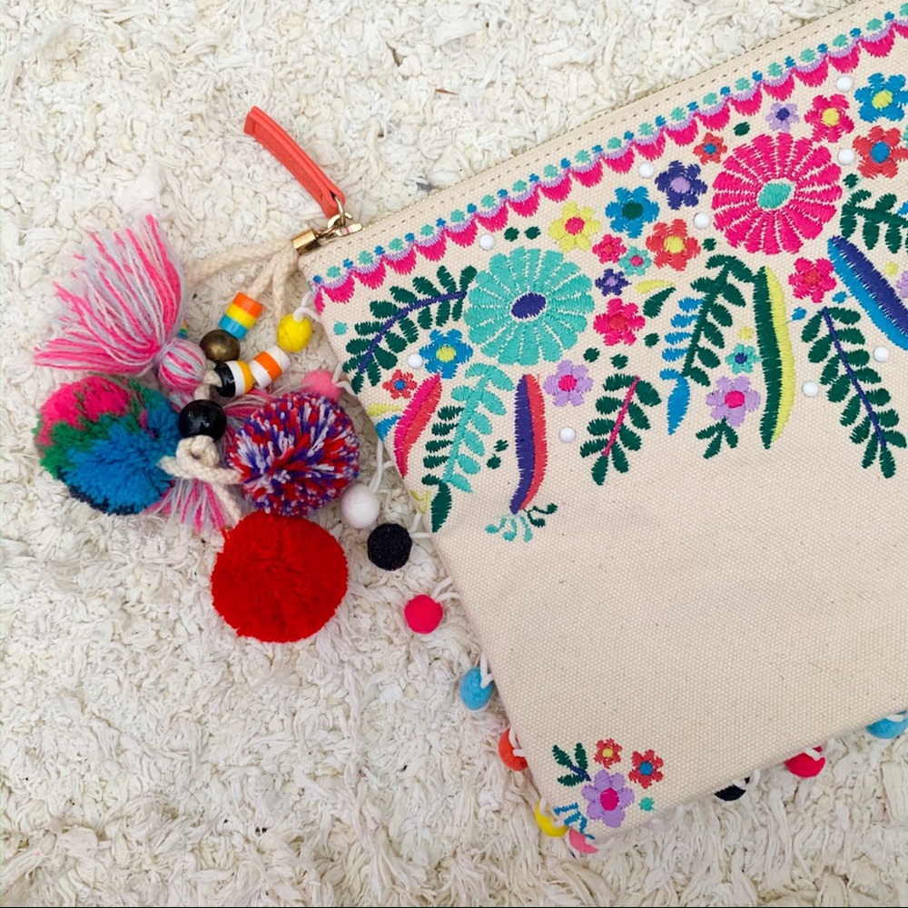 Steve Madden embroidered pom pom clutch bag